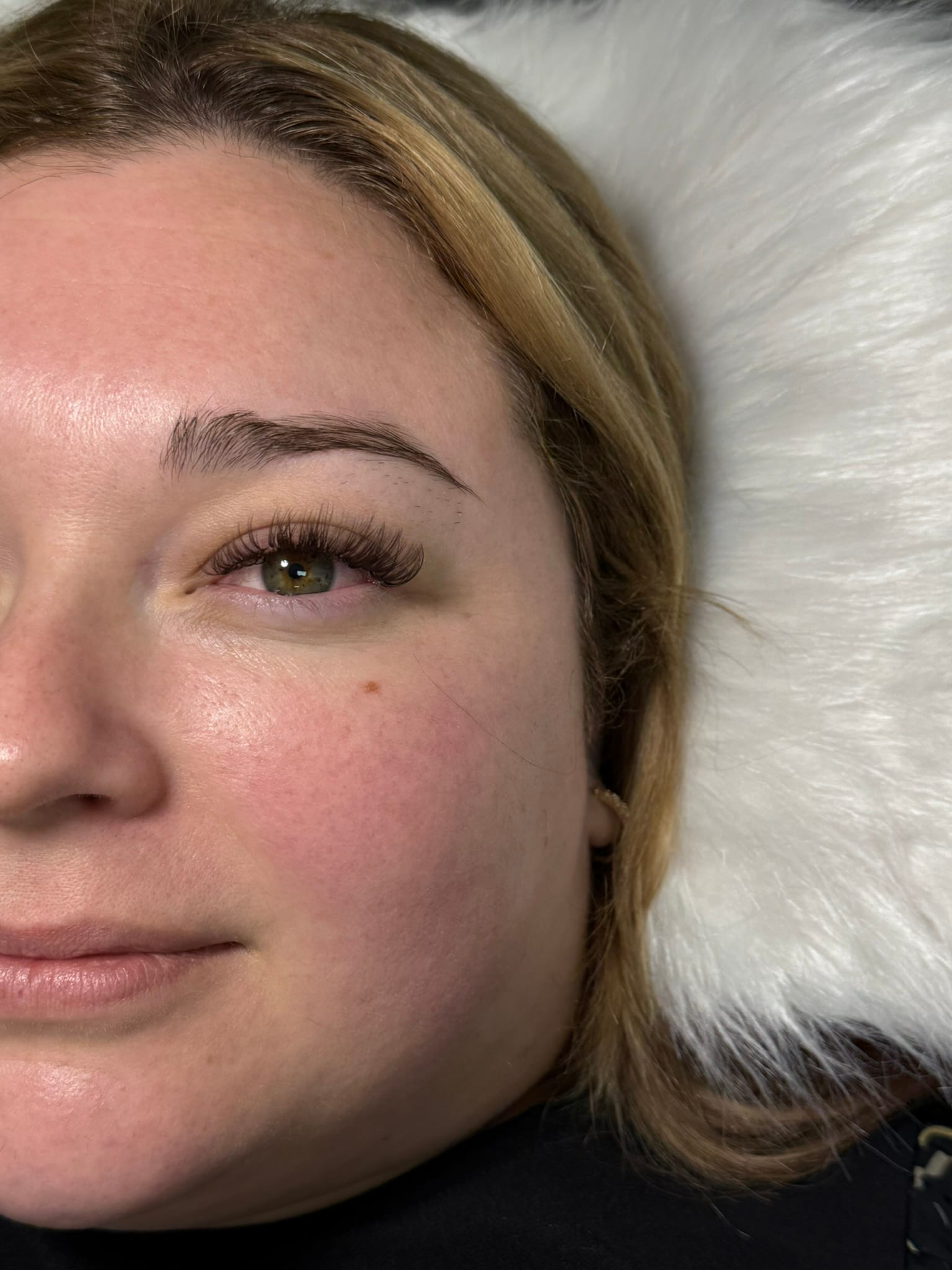 Close-up showing a softly defined Hybrid lash set.