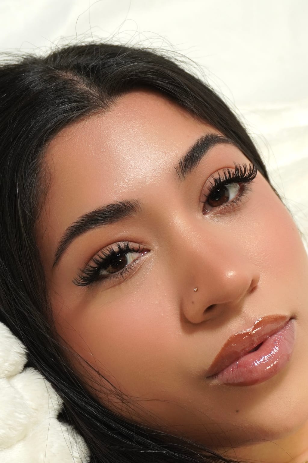 Close-up portrait showing a softly dimensional lash look.